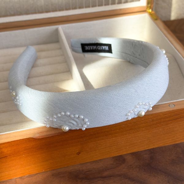 Satin Pearl Accent Headband featuring elegant detailing and soft pastel tones – perfect for stylish everyday or bridal wear