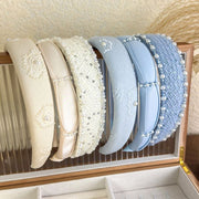  Satin Pearl Accent Headband featuring elegant detailing and soft pastel tones – perfect for stylish everyday or bridal wear