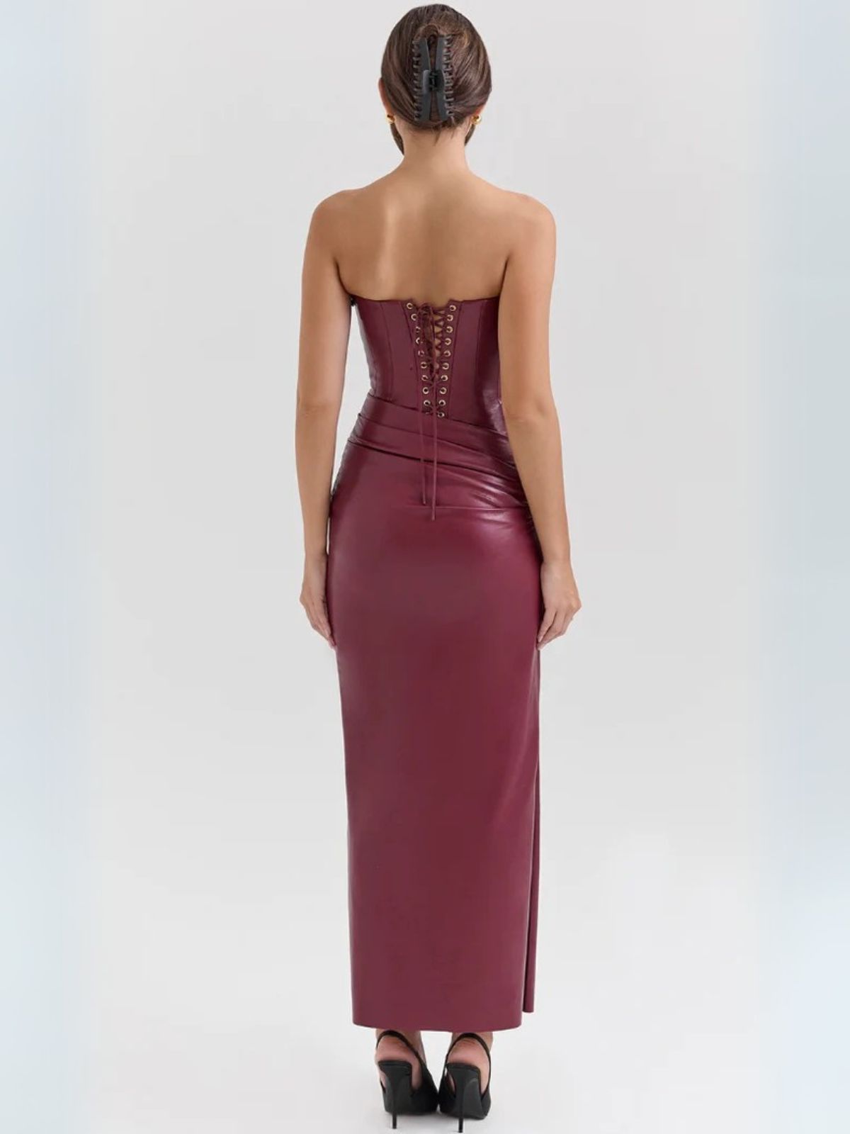 carlett Leather Dress - Rear view of the strapless red leather dress with lace-up detailing for a perfect fit.