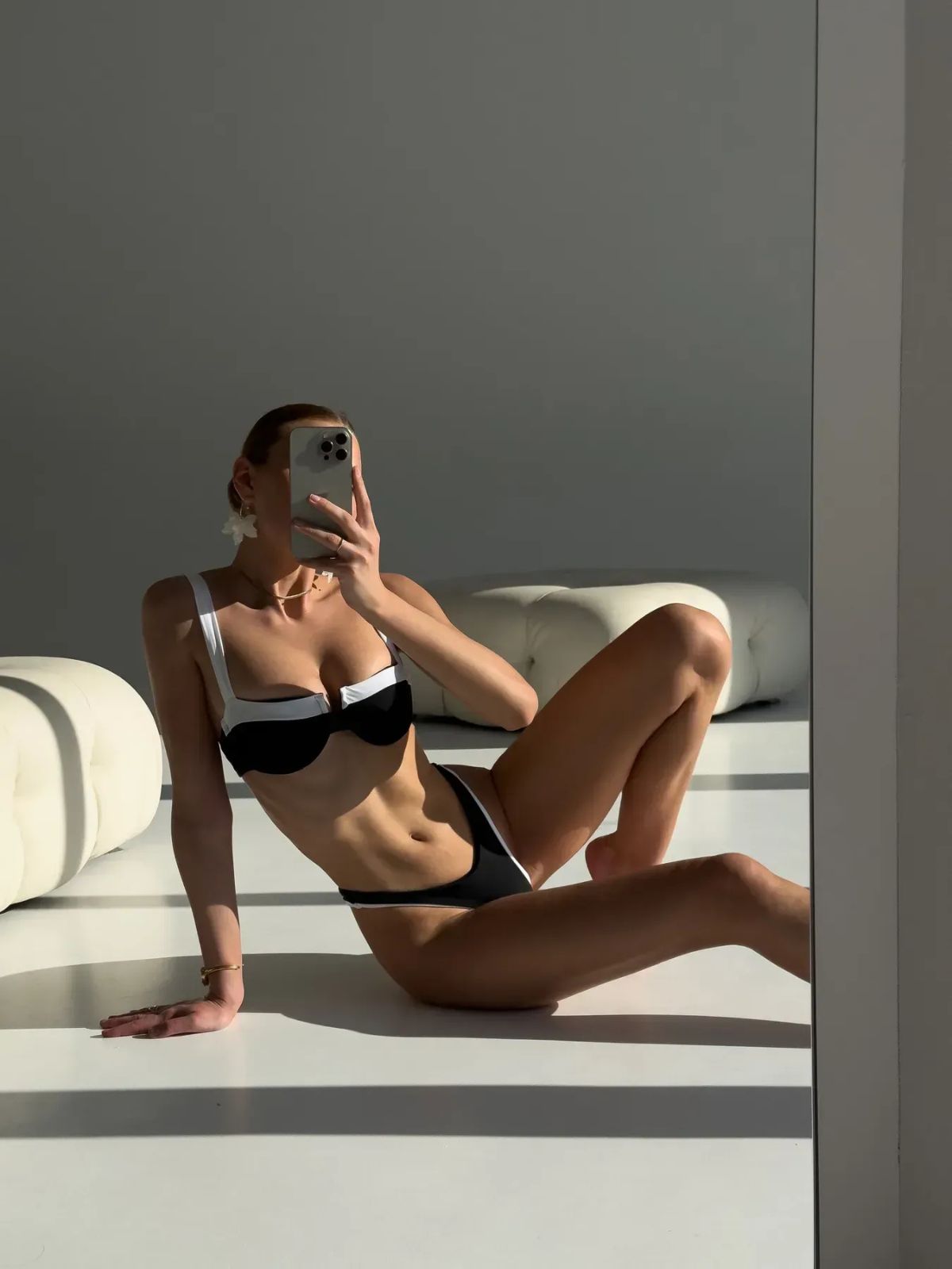Two-Tone Black and White Bikini Set shown in a mirror selfie, capturing natural light and full body angles.