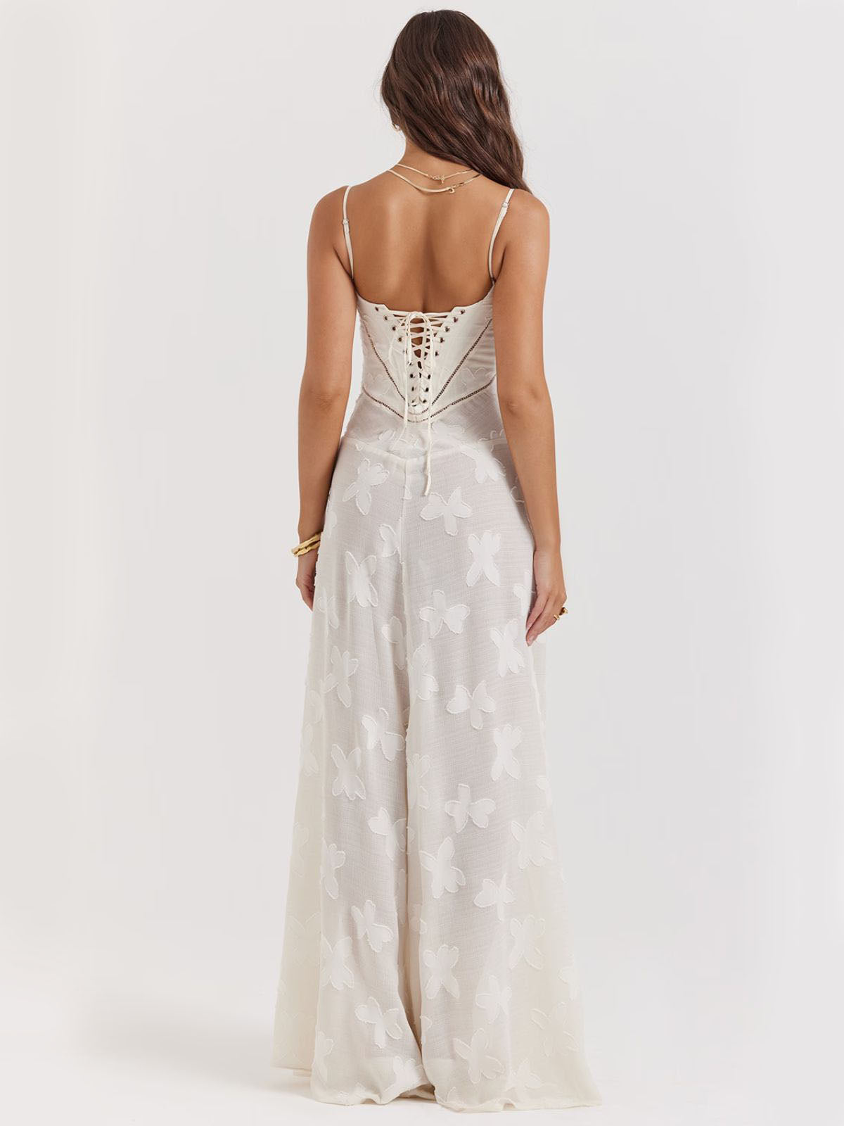 Back view of white floral dress highlighting the lace-up corset design and elegant embroidery for a romantic touch.