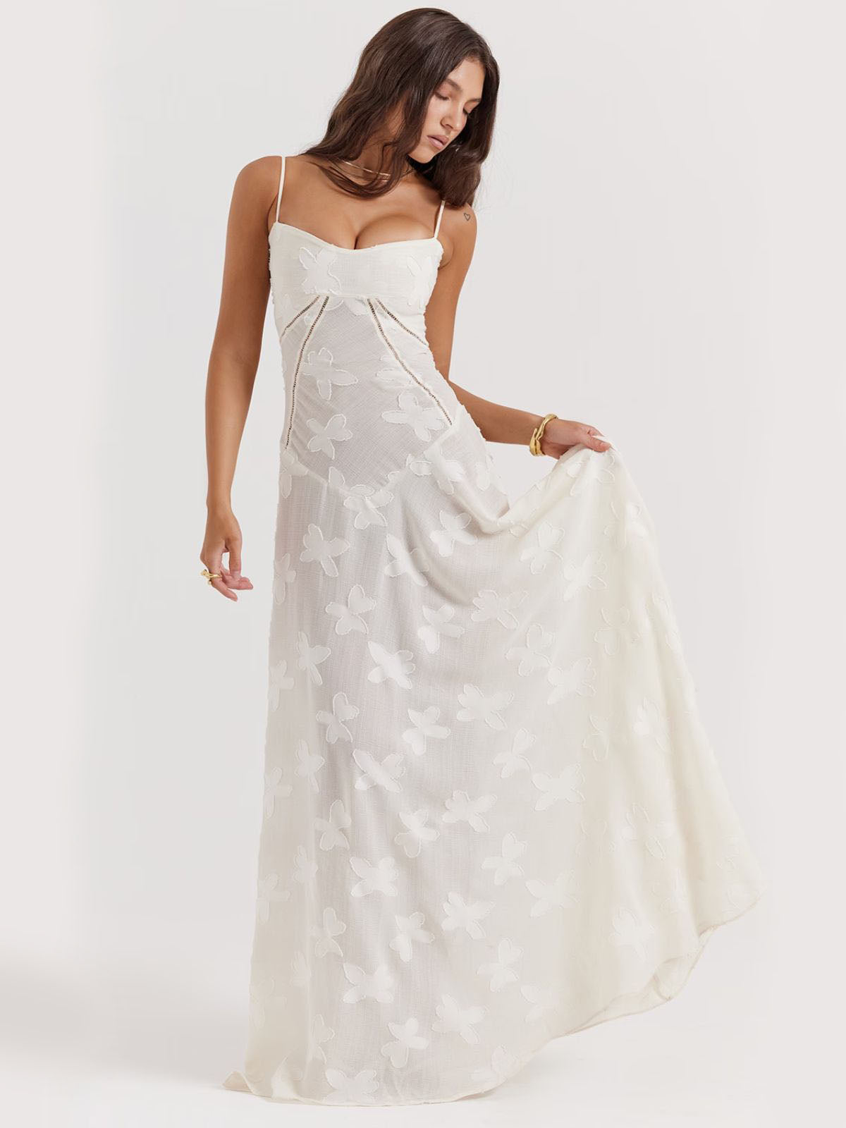 White floral dress with a sweetheart neckline, fitted bodice, and elegant lace details—ideal for weddings and special events.