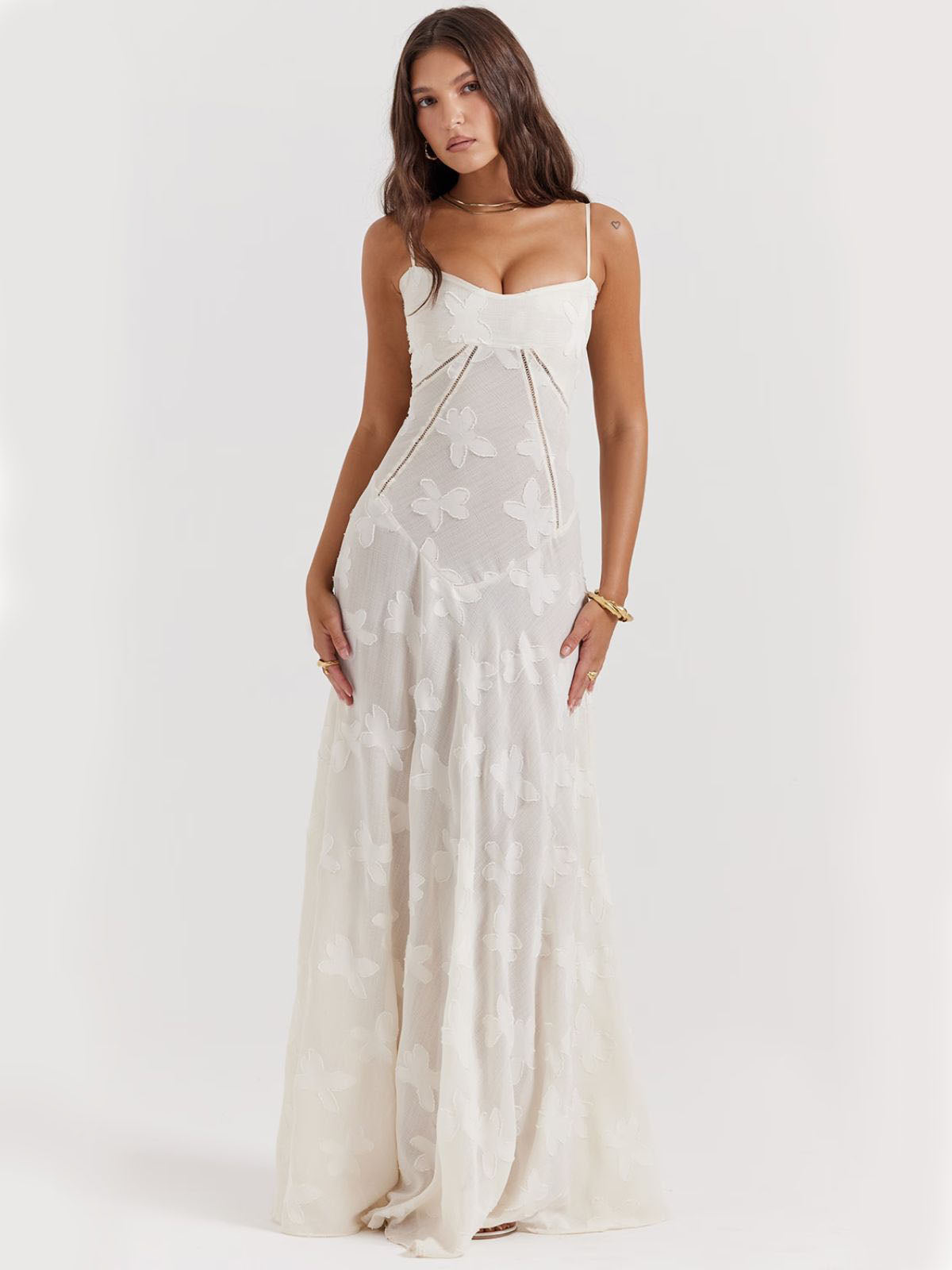 White floral dress with a lace-up back, delicate floral embroidery, and a flowy silhouette—perfect for elegant occasions.