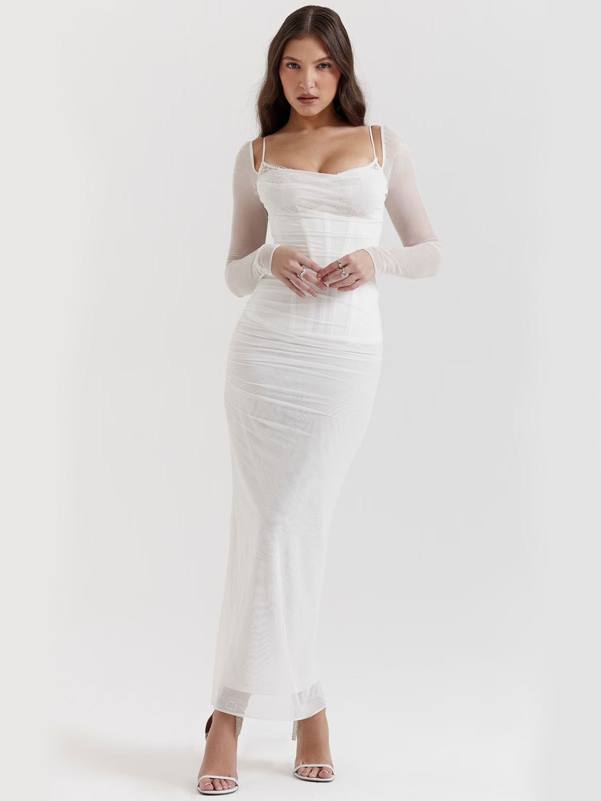 White lace maxi dress side view with sheer sleeves and back slit, a timeless choice for elegant occasions.